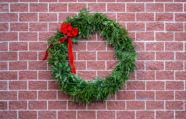 close up on Christmas wreath on the brick wall