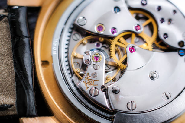 Close-Up Of Golden Machine Part On Table