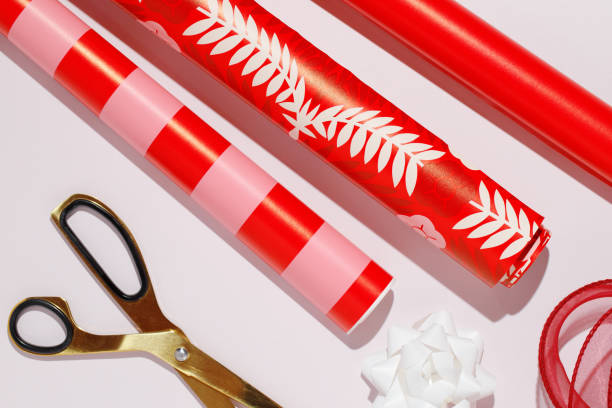 istock Wrapping paper and bows on pink background. Mockup 2199652466