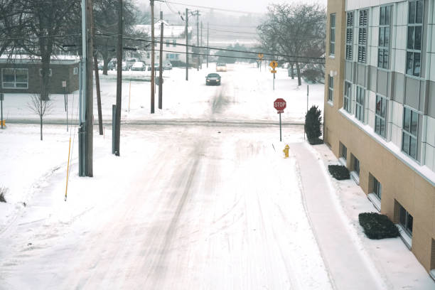 istock city street after snow storm 2199652728