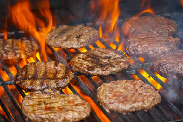 istock barbecue grill cooking burger steak on the fire 2199652752