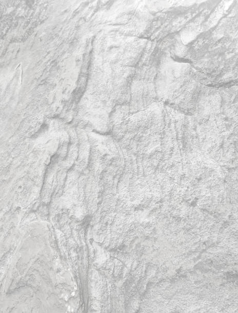 istock Monochrome black and white (light grey) stone wall or rock for abstract  background and texture. beautiful patterns, space for work, banner,seamless wallpaper, close up.Vertical. 2199654634