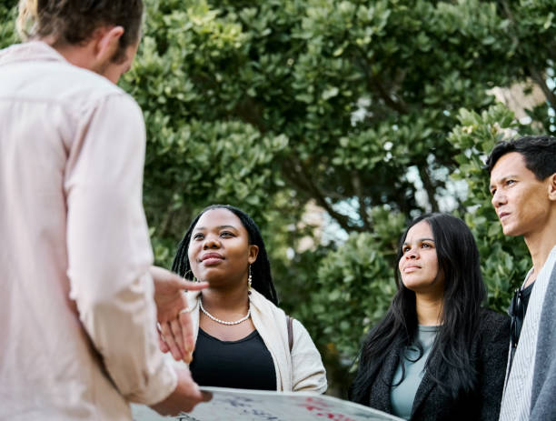 istock Business team conversing while standing together outdoors 2199655330