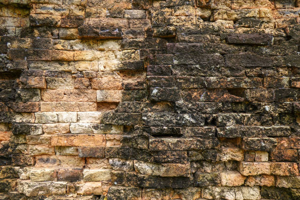 istock Old red black stone brick wall made with antique blocks for abstract seamless background and texture. beautiful patterns, space for work, close up. 2199659426