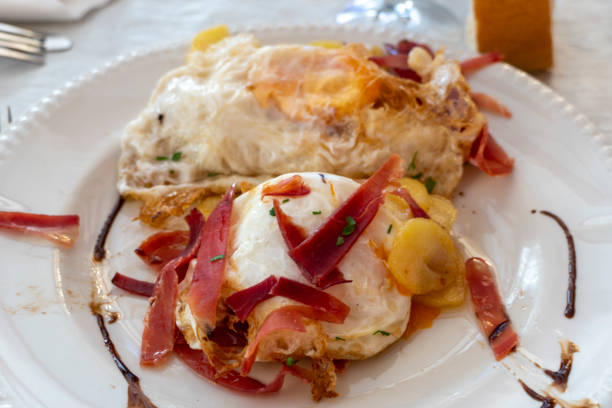 istock Fried eggs with Iberian ham on plate Spanish food 2199660242