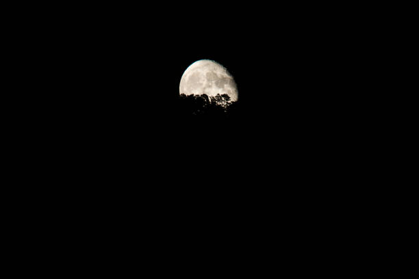 Waning moon rising from behind a hill Mora de Rubielos Teruel Aragon Spain