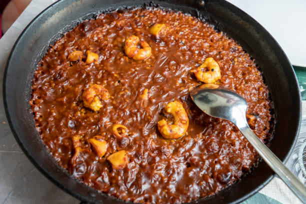 istock Traditional seafood paella in the pan on a table Murcia Spain 2199662816
