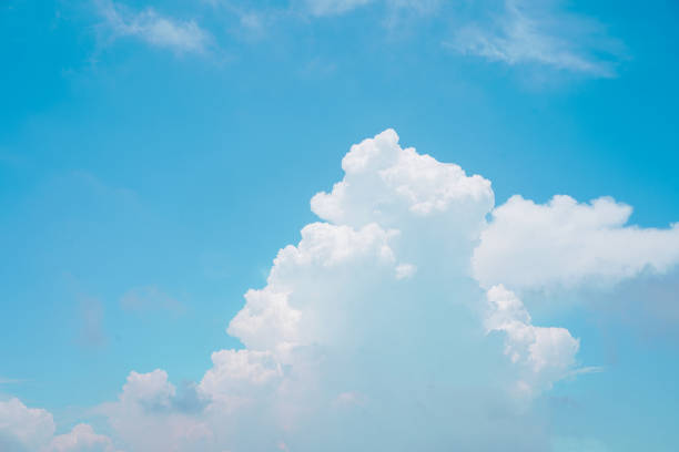 istock Beautiful white puffy clouds against blue sky on a sunny Summer day. 2199662872