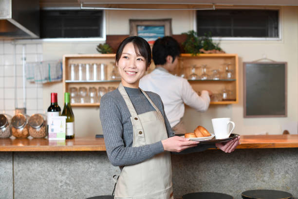 istock Young Asian woman working at a restaurant 2199664544