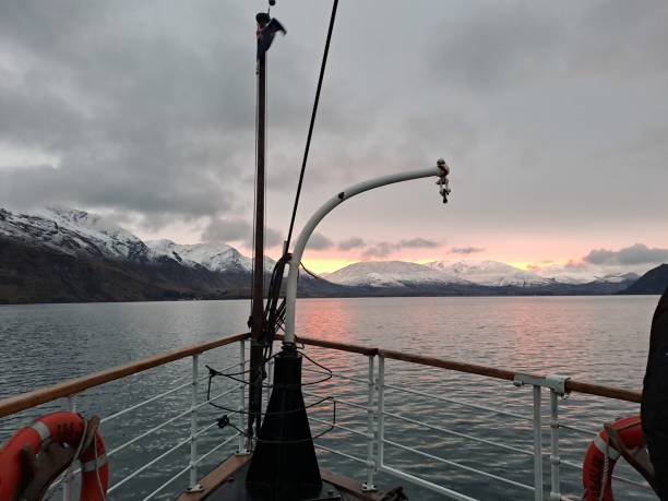 istock Winter sunset boat mountain view 2199665858