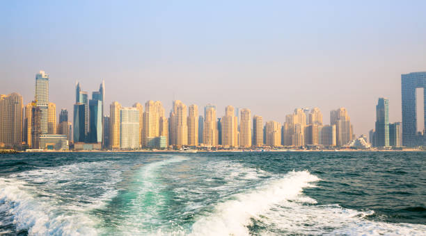 istock Dubai Marina beach skyscrapers, view at sunset from the boat 2199666390
