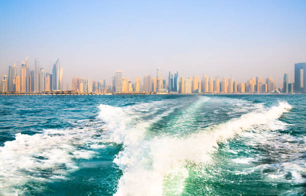 istock Dubai Marina beach skyscrapers, view at sunset from the boat 2199666402