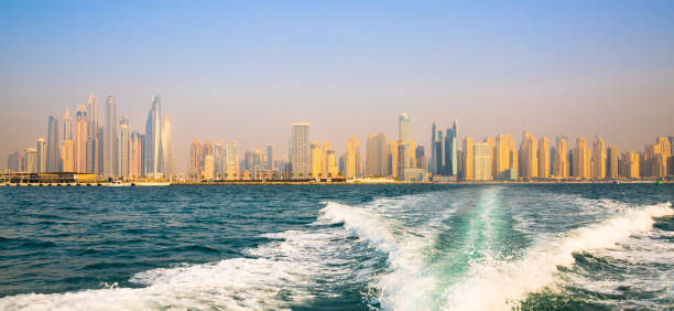 istock Dubai Marina beach skyscrapers, view at sunset from the boat 2199666409