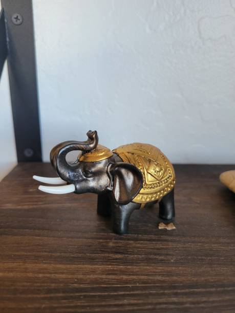 istock A detailed elephant statue is beautifully crafted on a wooden table 2199669561