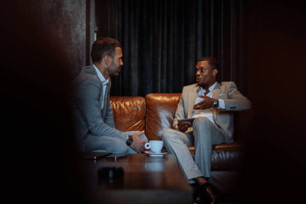 istock Businessmen discussing during a meeting in a lounge bar 2199672531