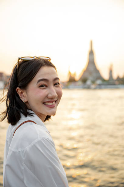 istock Young woman looking at camera and smiling in Bangkok 2199673667