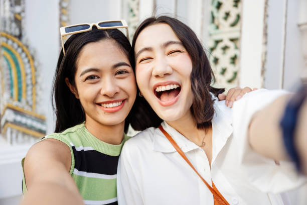 istock Two young women taking a selfie in bangkok, thailand 2199673721