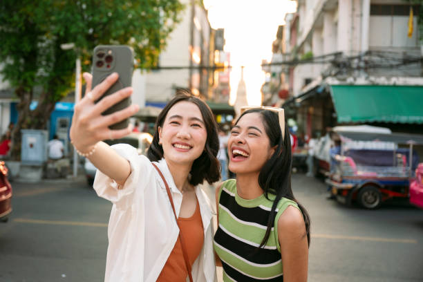istock Two young women taking a selfie in bangkok, thailand 2199673723