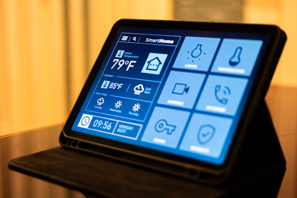 istock Smart Home Control Tablet in Modern Living Room at Night 2199676742