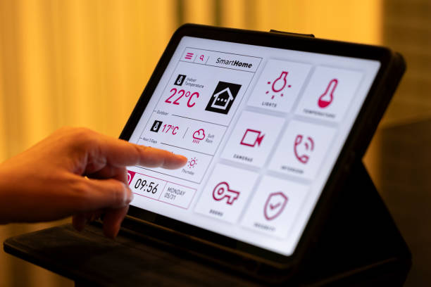 istock Smart Home Control Tablet with Interactive UI in Cozy Living Room at Night 2199676773