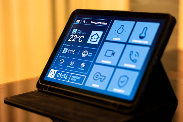 istock Smart Home Control Tablet in Modern Living Room at Night 2199676869
