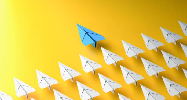 istock Leadership concept, blue leader plane leading white planes, on yellow background 2199676874