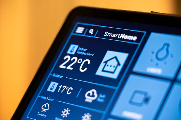 istock Smart Home Control Tablet in Modern Living Room at Night 2199676880