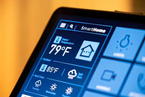 istock Smart Home Control Tablet in Modern Living Room at Night 2199676881