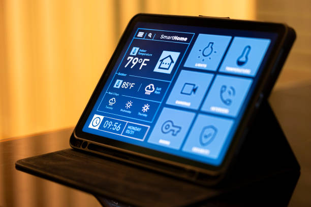 istock Smart Home Control Tablet in Modern Living Room at Night 2199676905