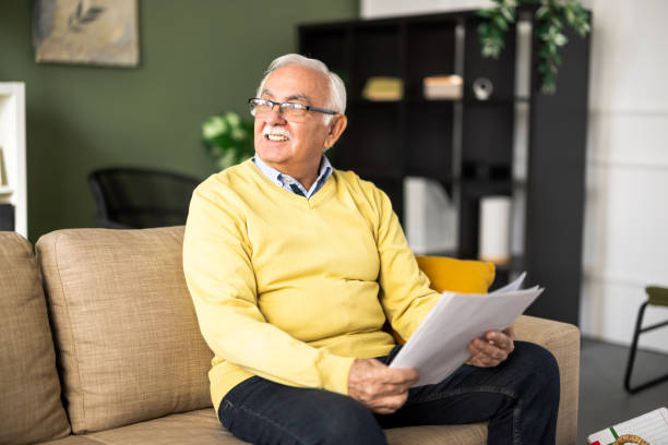 istock Senior man planning his finances at home 2199679398