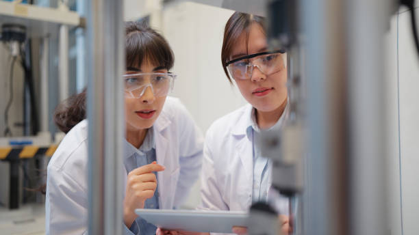 istock Two multi-racial female scientists working together in laboratory 2199680629