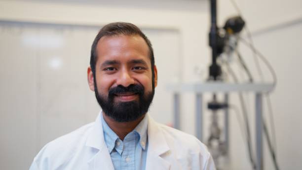 A portrait of a diverse young male scientist in a laboratory.