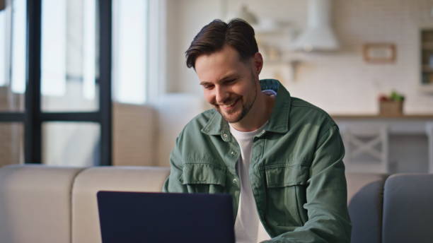 istock Remote worker typing laptop at home kitchen closeup. Freelancer pondering ideas 2199686836