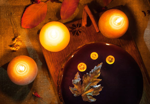 istock Autumn chocolate cake with candles 2199687020