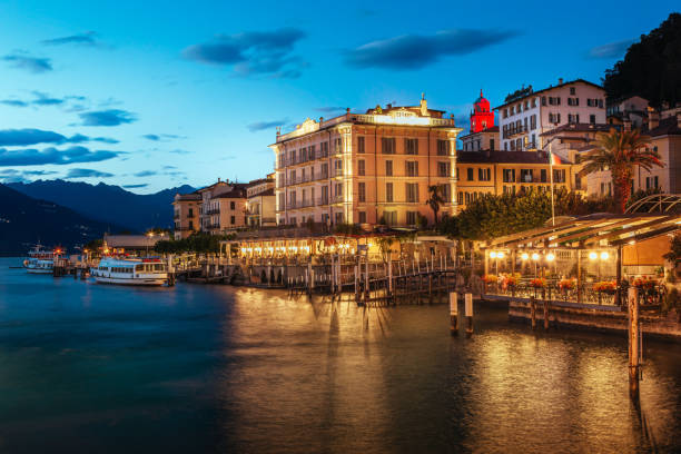 istock Bellagio waterfront reflecting on Lake Como at twilight with illuminated hotels and restaurants 2199689236