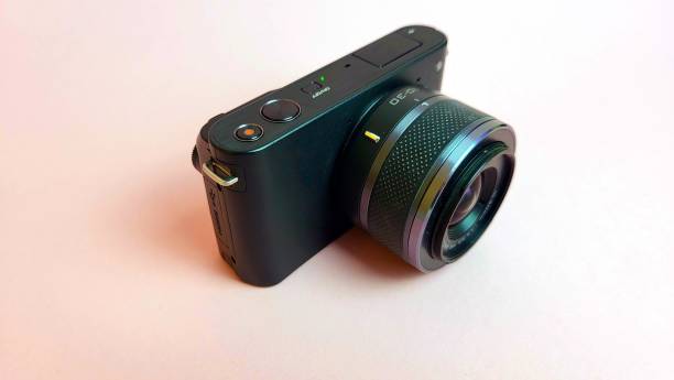 istock A black camera with a lens on a white background 2199691698