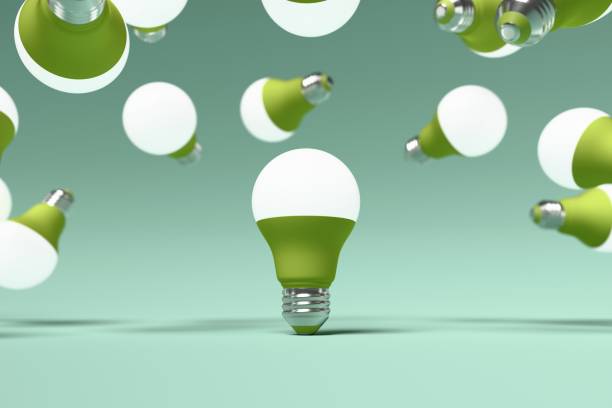 istock Glowing Led lightbulb is surrounded by many other light bulbs, floating in air turquoise background. 3d illustration, render 2199694622