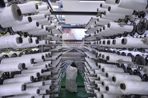 istock Cotton textile factory equipment is in operation 2199698193