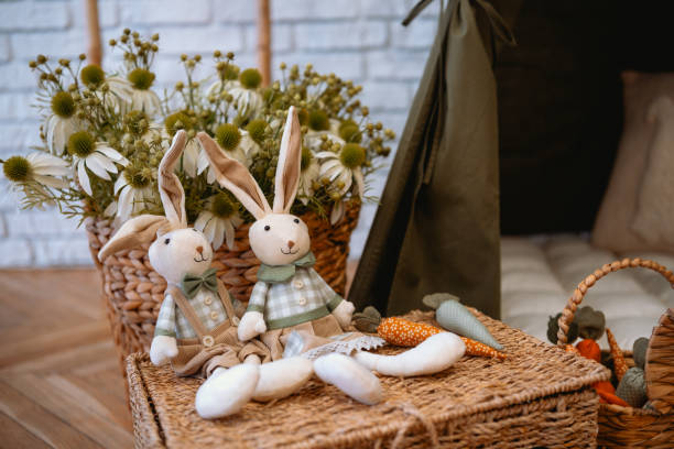 istock Soft bunnies and vibrant carrots arranged in a cozy indoor setting 2199699992