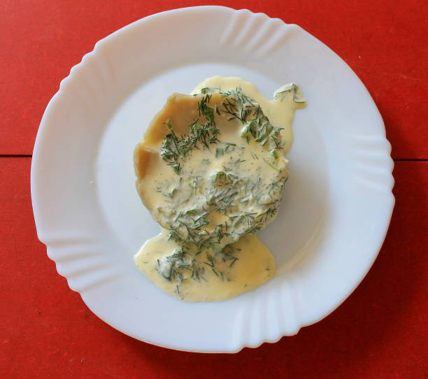 Artichoke cooking artichoke fruit with sauce and herbs