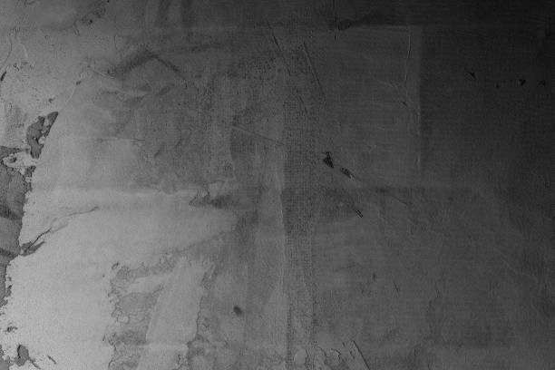 istock Texture of aged concrete wall with peeling paint in grayscale tones 2199700104