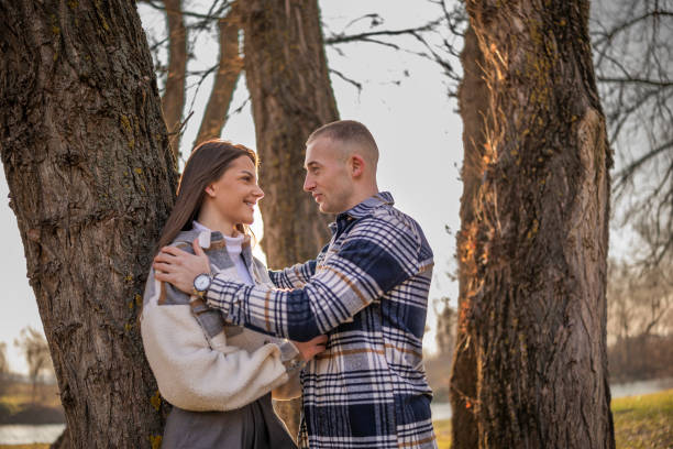 Happy couple enjoys their love while embracing on a mountain. Love, beauty, nature.