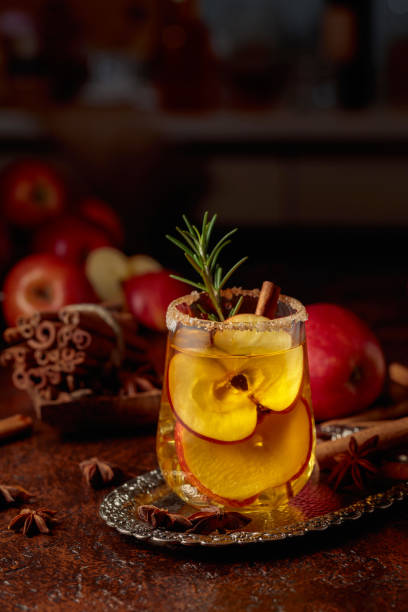 istock Apple cider with apple slices and a rosemary branch. 2199714113