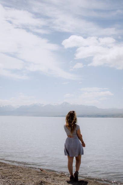 istock Girl watching the lake 2199721669
