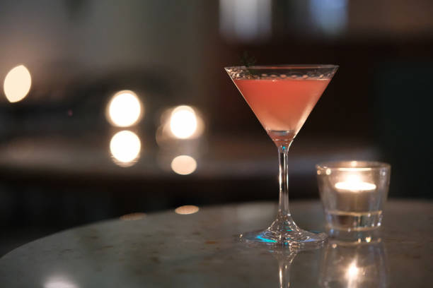 istock cocktail and candlelight on night bar table with bokeh 2199723572