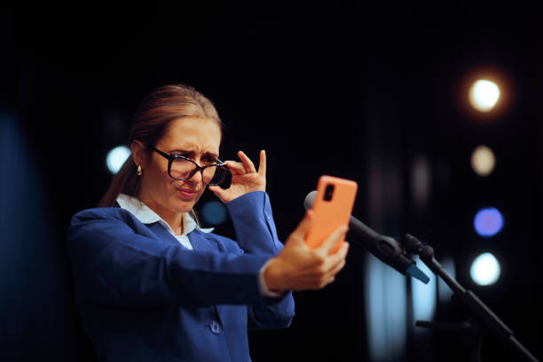 Woman Taking off Glasses from presbyopia Reading from Phone