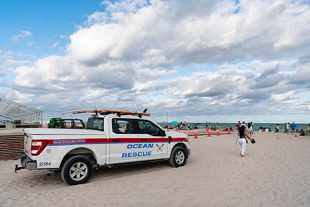Miami, Florida, USA - November 16, 2024: Fire rescue of Miami beach. Rescue firetruck at the beach. Firetruck vehicle, side view. Fire rescue car. Car from fire department of Miami. Firetruck by Ford.
