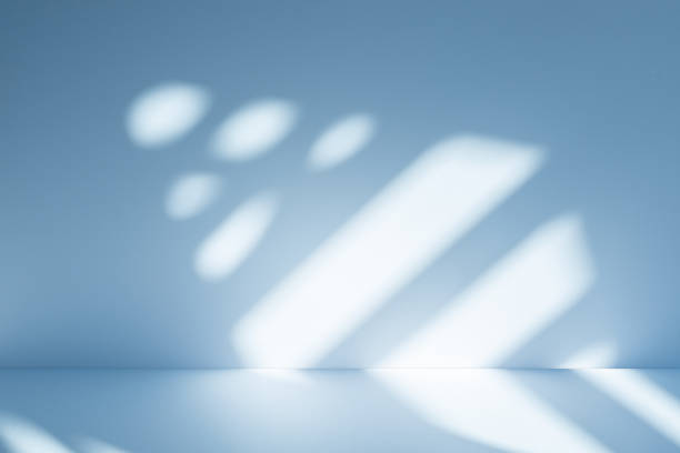istock Studio style background wall decoration presentation uses white and blue tones. with shadows cast from a nearby window, concept creating a decorative 2199737410