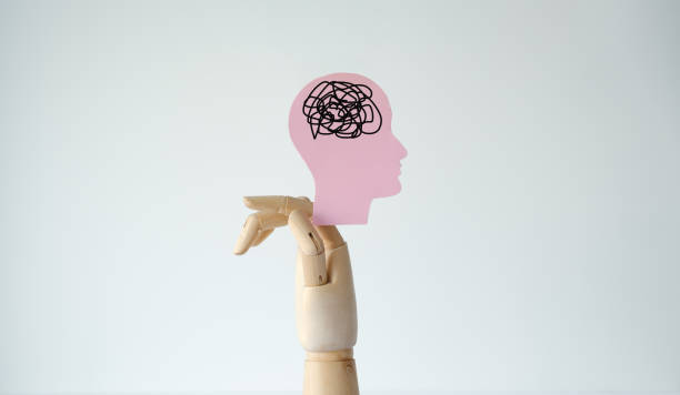 istock A hand holding a head with a brain that is tangled 2199739184
