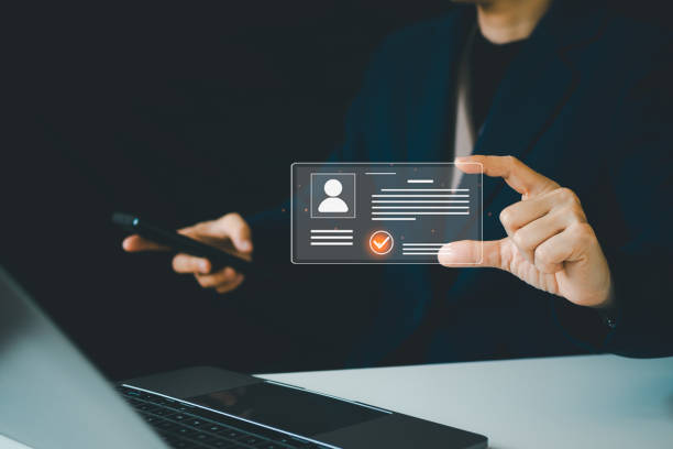 istock Digital identification or digital ID concept. Businesswoman use laptop and hand touch virtual screen of digital identification card to accessing databases by digital identity for cyber security. 2199742761